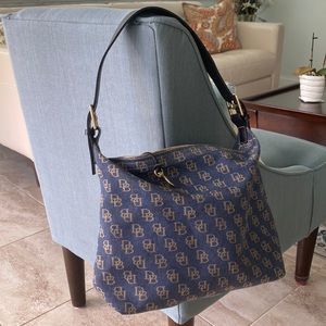 Dooney & Bourke denim shoulder bag with dark blue leather strap.